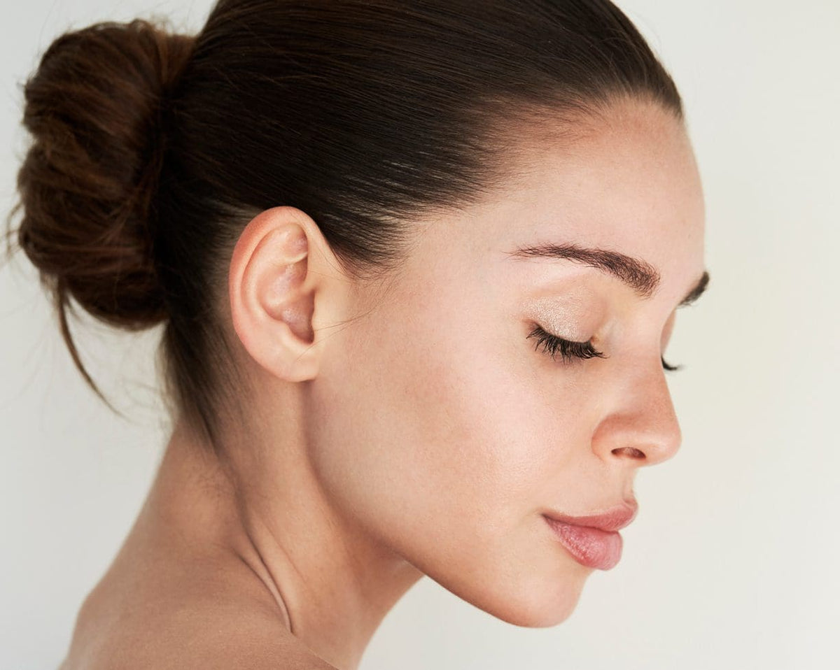 Side profile of a woman with smooth, even skin